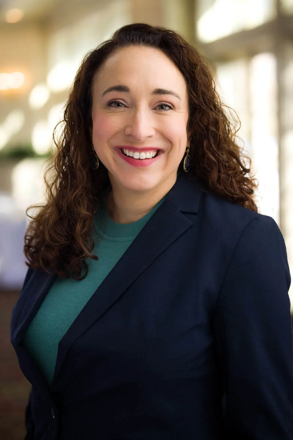 Meg DE Rest Assn headshot 2026.jpg